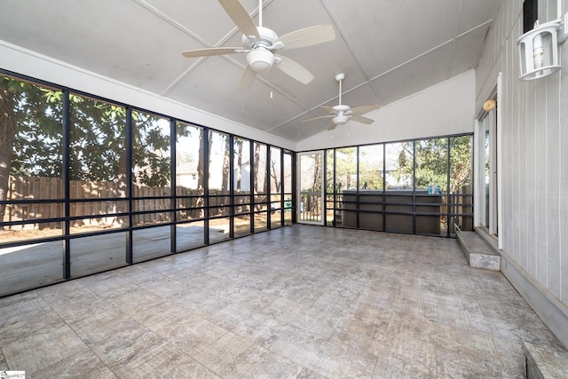 unfurnished sunroom with lofted ceiling and a ceiling fan