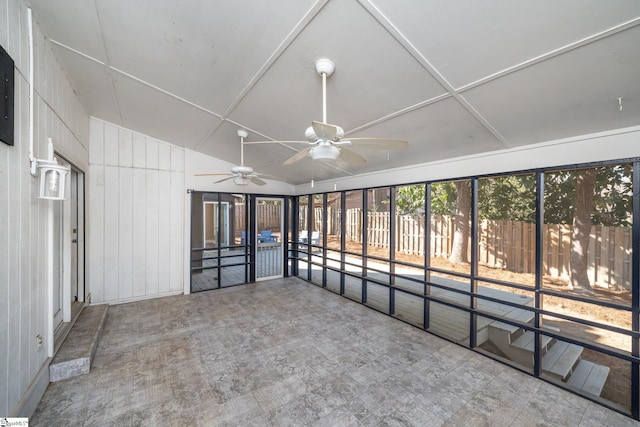 unfurnished sunroom with ceiling fan