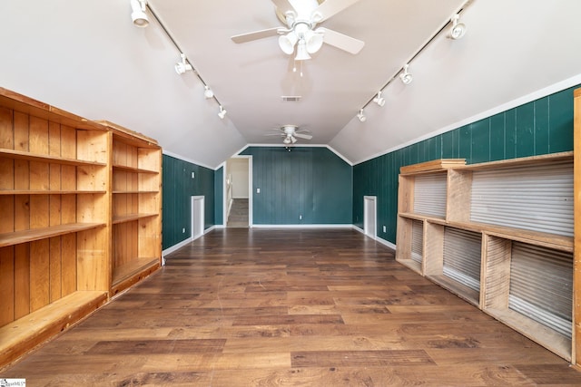 additional living space with ceiling fan, visible vents, lofted ceiling, and wood finished floors