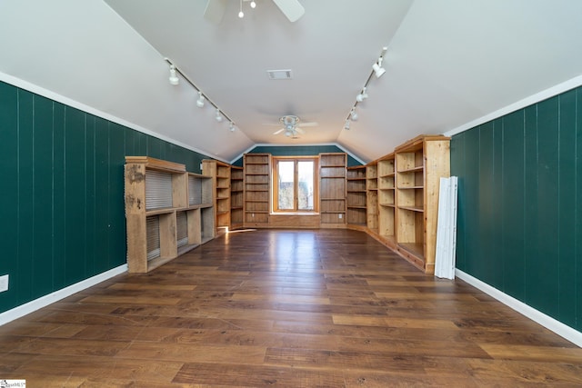 bonus room with visible vents, a ceiling fan, dark wood-type flooring, and lofted ceiling