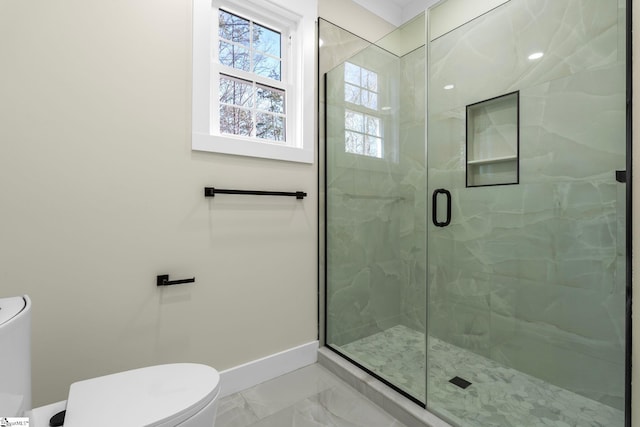 full bathroom with baseboards, toilet, marble finish floor, and a shower stall