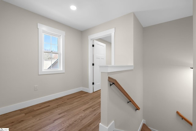 interior space with recessed lighting, baseboards, and wood finished floors