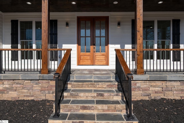 property entrance with french doors and covered porch