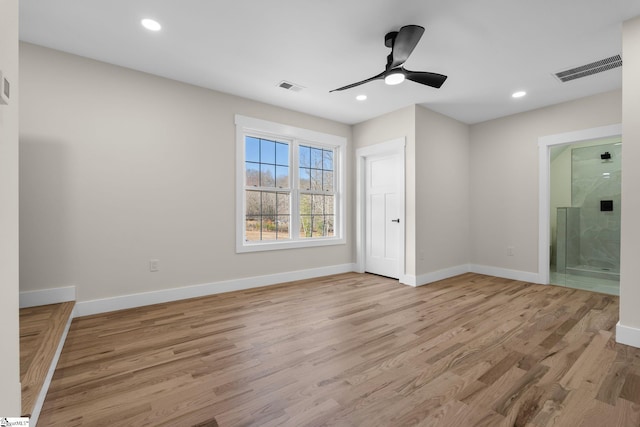 empty room with recessed lighting, visible vents, baseboards, and light wood finished floors