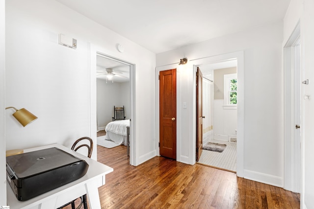 interior space with baseboards and hardwood / wood-style floors