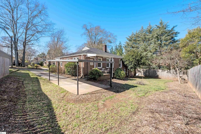 view of yard with a patio and a fenced backyard