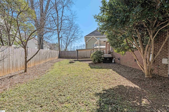 view of yard with a fenced backyard