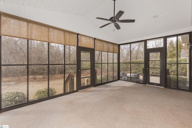 unfurnished sunroom with vaulted ceiling and a ceiling fan