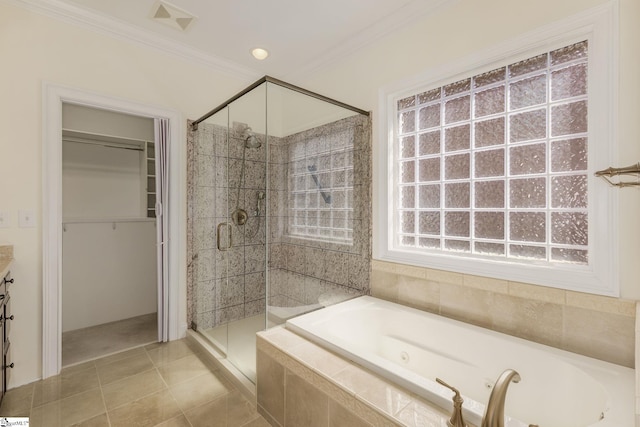 bathroom featuring a spacious closet, visible vents, a jetted tub, ornamental molding, and a stall shower