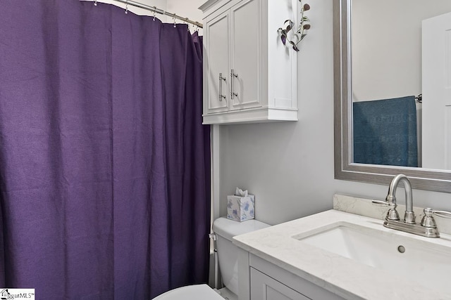 full bath featuring toilet and vanity