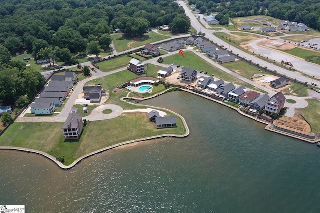 birds eye view of property featuring a water view and a residential view