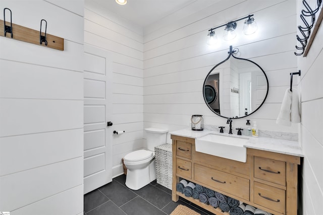 bathroom with tile patterned flooring, toilet, and vanity