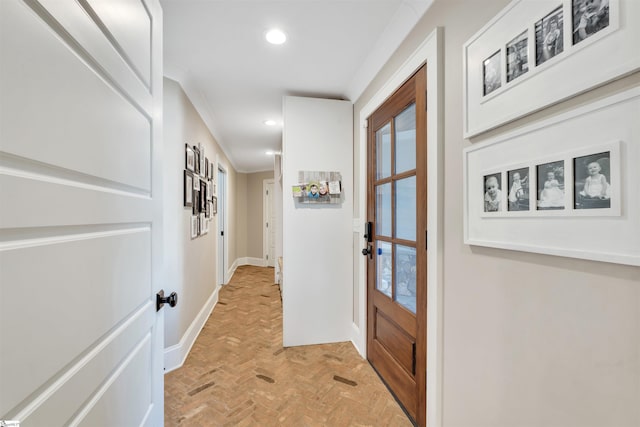 doorway featuring plenty of natural light, recessed lighting, brick floor, and baseboards