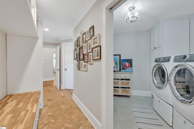 laundry room featuring recessed lighting, baseboards, and washing machine and clothes dryer