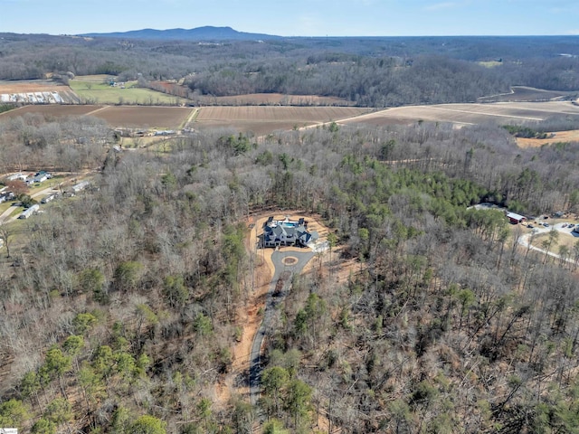 bird's eye view with a mountain view and a forest view