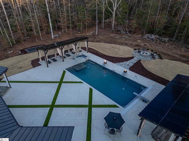 outdoor pool with a patio area