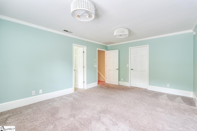 unfurnished bedroom featuring visible vents, baseboards, carpet, and ornamental molding