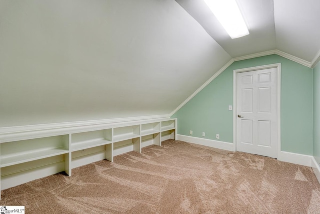 bonus room featuring baseboards, carpet floors, and vaulted ceiling