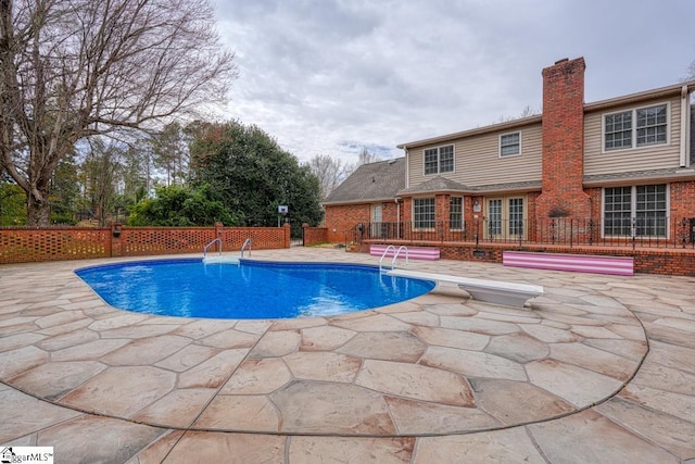 view of pool featuring fence, a patio area, and a fenced in pool