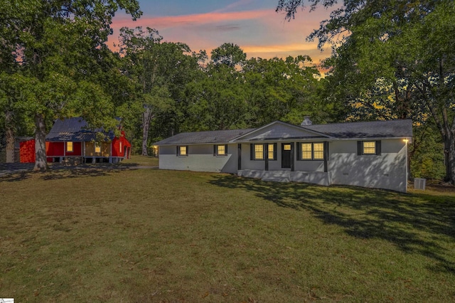 ranch-style house featuring a yard