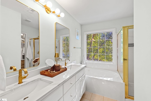 full bathroom featuring tile patterned floors, a garden tub, a shower stall, and a sink