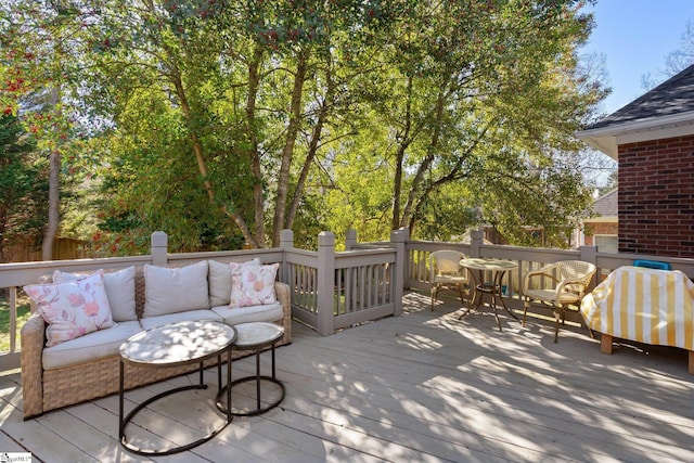 wooden terrace featuring an outdoor hangout area