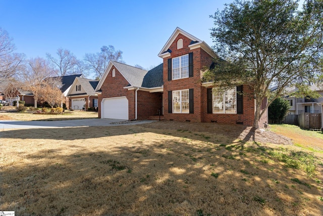 traditional-style house featuring crawl space, brick siding, a garage, and concrete driveway