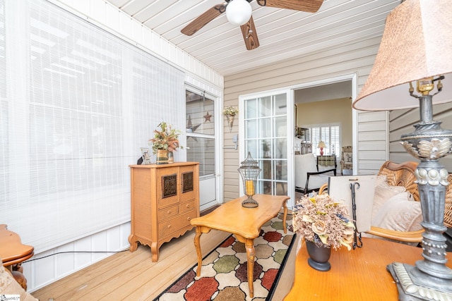 sunroom / solarium featuring ceiling fan