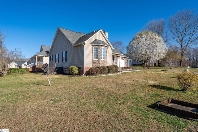 view of property exterior featuring a yard, a garage, and a chimney