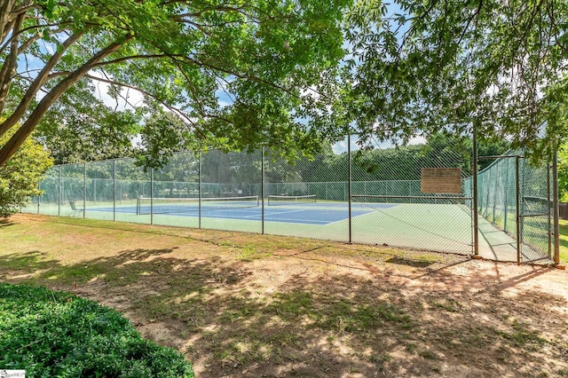 view of tennis court with fence