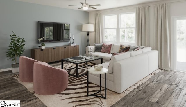 living room featuring baseboards, light wood-style floors, and a ceiling fan