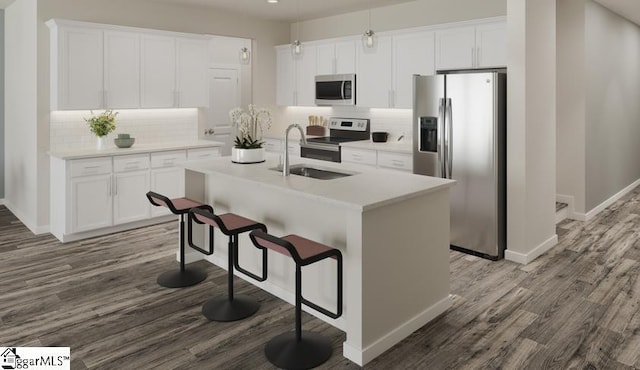 kitchen with white cabinets, appliances with stainless steel finishes, dark wood-type flooring, and a sink