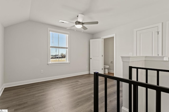 bonus room with a ceiling fan, vaulted ceiling, wood finished floors, and baseboards