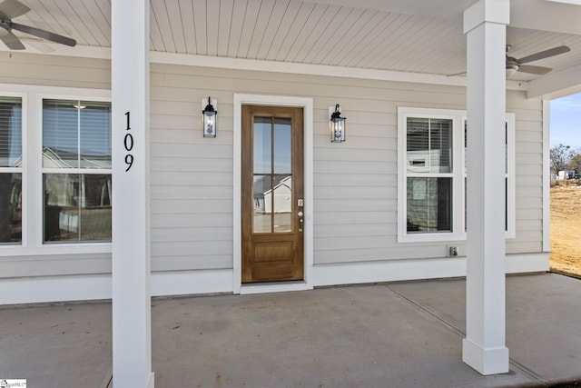 property entrance with a porch and ceiling fan