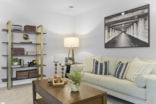 living area featuring visible vents, baseboards, and carpet floors