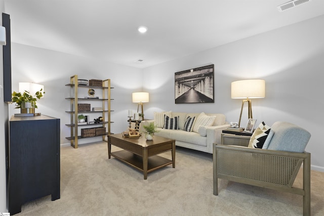 living area with light carpet, visible vents, recessed lighting, and baseboards