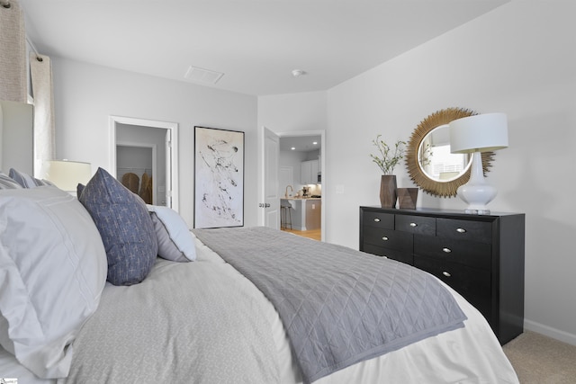 carpeted bedroom featuring baseboards