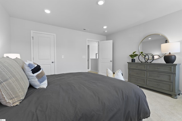 bedroom with recessed lighting, visible vents, and light carpet