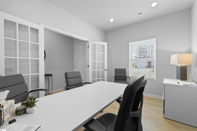 office space with visible vents, recessed lighting, baseboards, and light wood-style floors