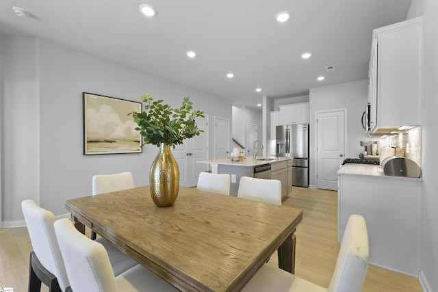 dining space featuring visible vents, recessed lighting, and light wood-style floors