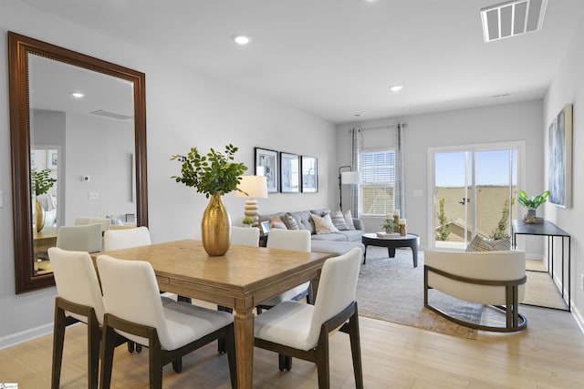 dining area with recessed lighting, visible vents, and light wood-style floors