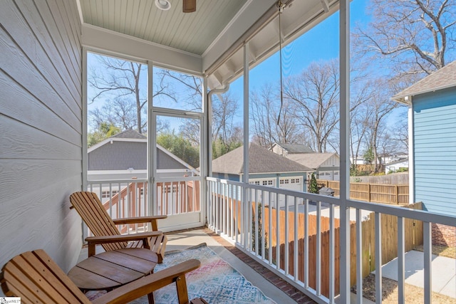 sunroom / solarium with a residential view