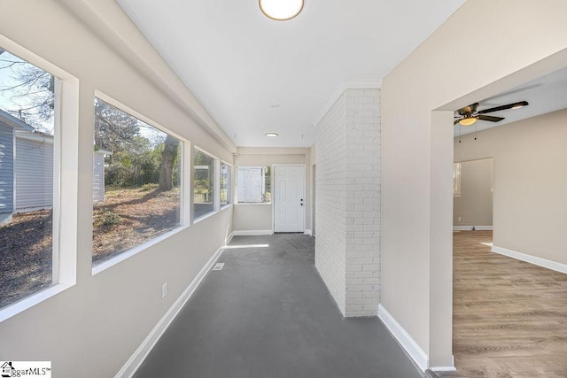 hallway featuring baseboards