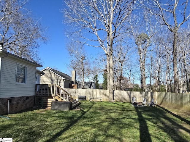 view of yard with stairway and a fenced backyard