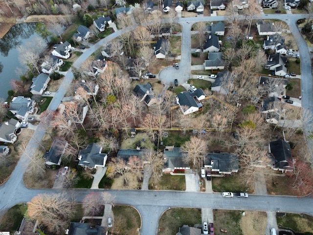 birds eye view of property with a residential view