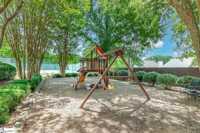 view of play area with a fenced backyard