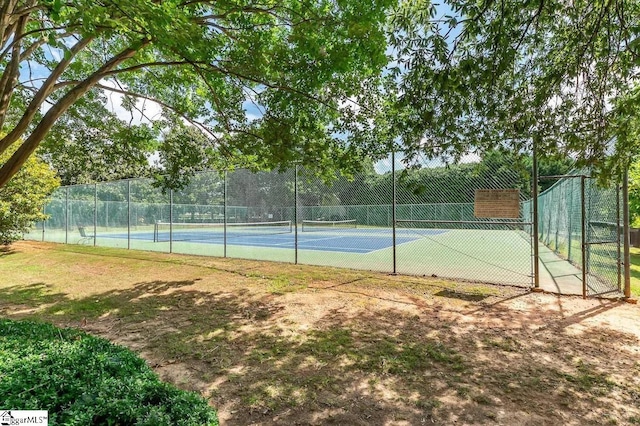 view of sport court with fence