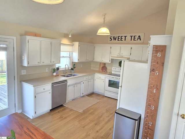 kitchen with light wood-style flooring, a sink, under cabinet range hood, white cabinetry, and white appliances