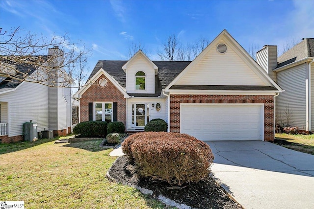 view of front of house featuring a front yard, central AC unit, driveway, an attached garage, and brick siding