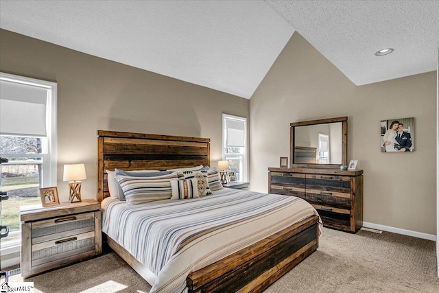 carpeted bedroom featuring baseboards, lofted ceiling, and a textured ceiling